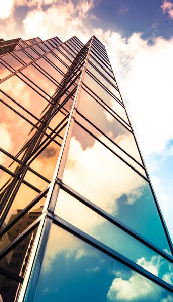 Glass skyscraper with a reflection of the sky