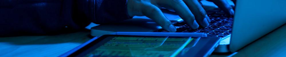 person using laptop at night