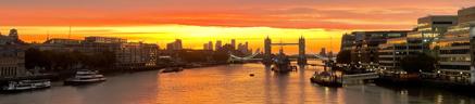 Image of sunset on river with buildings