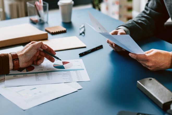 Business Colleagues Analyzing Financial Charts and Graphs