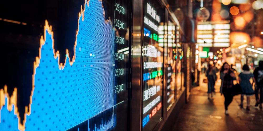 Stock exchange market display screen on a city street