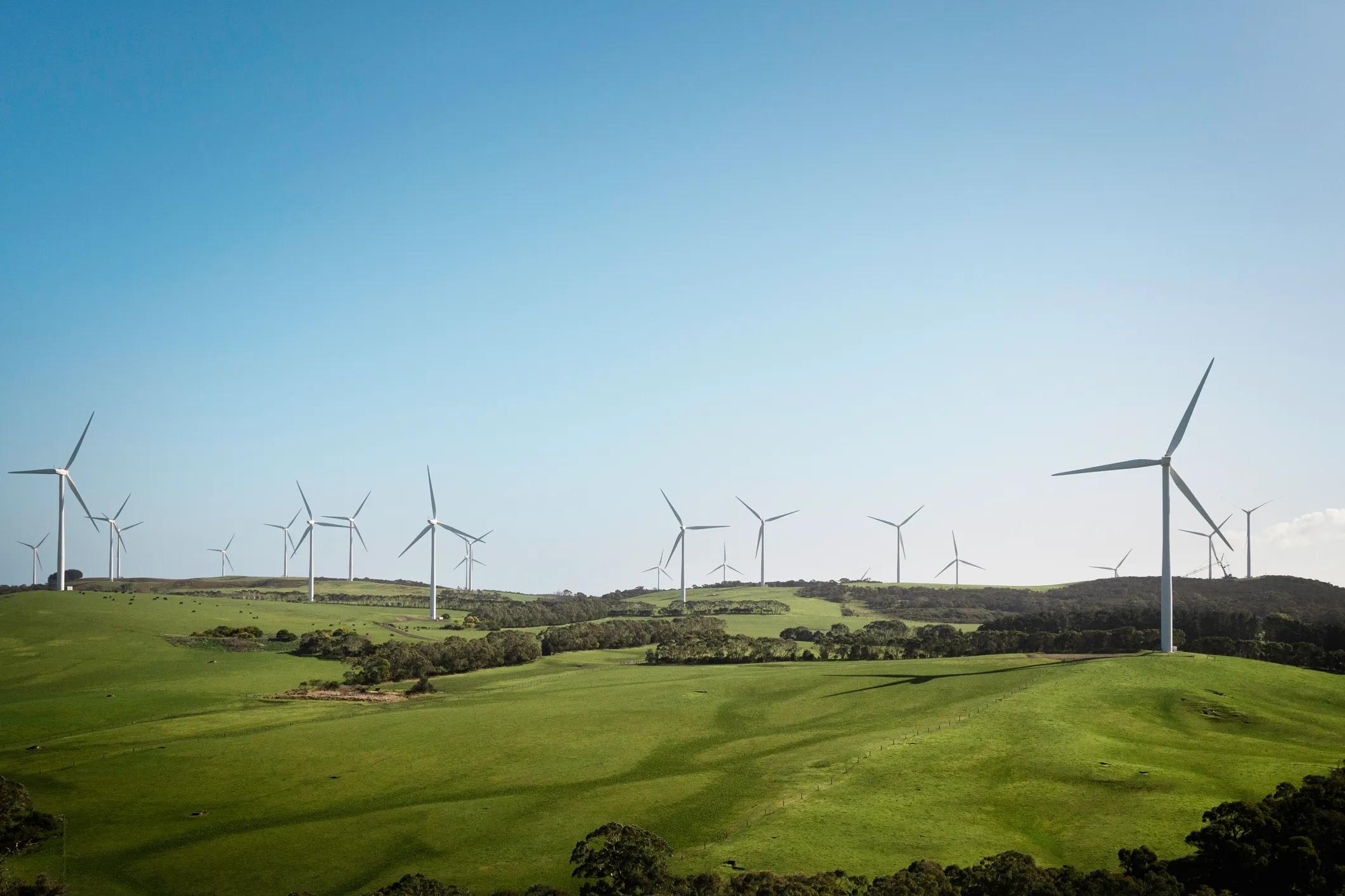 Aerial view of wind turbines and agriculture field