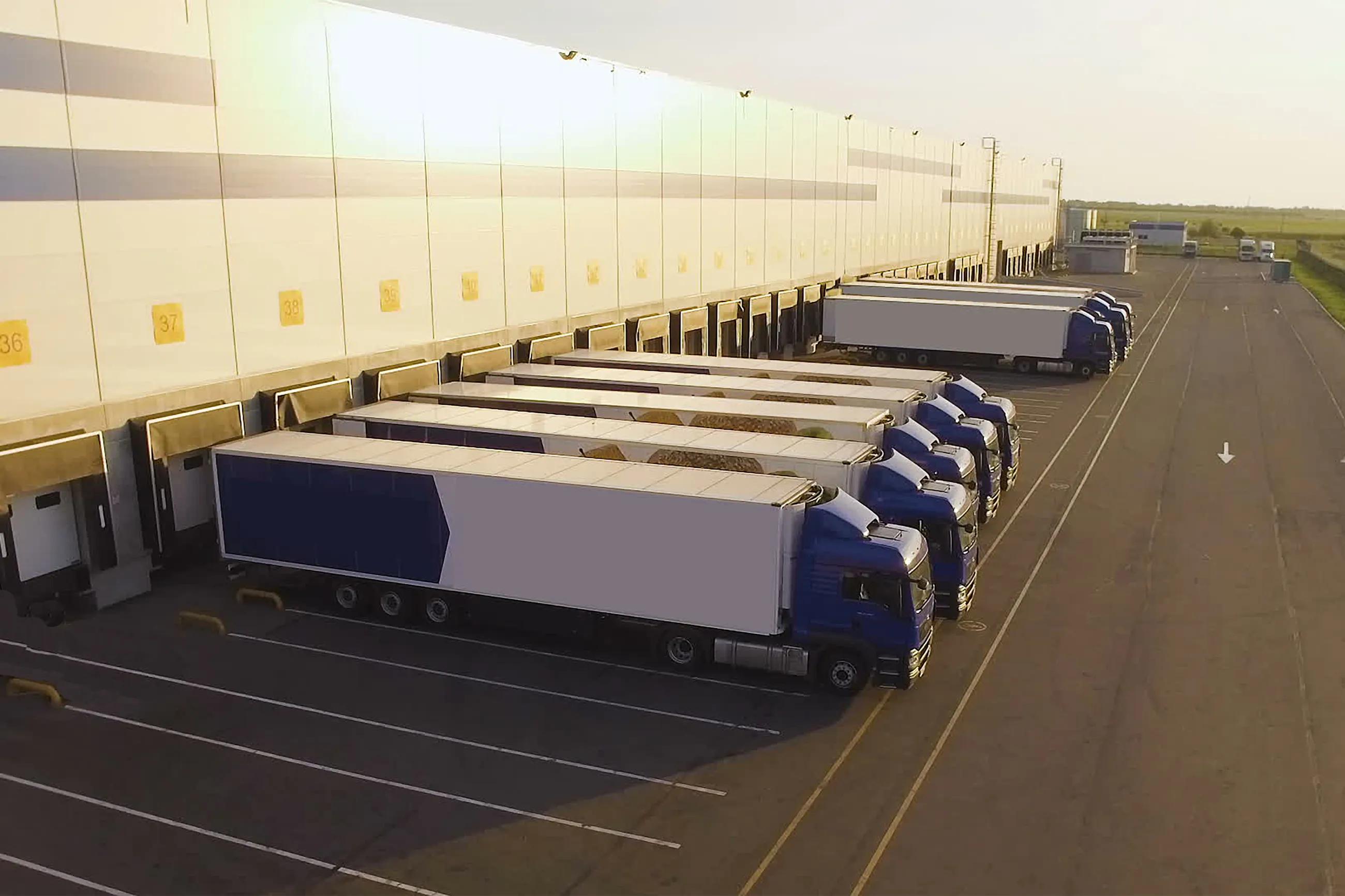 distribution warehouse with trucks awaiting loading
